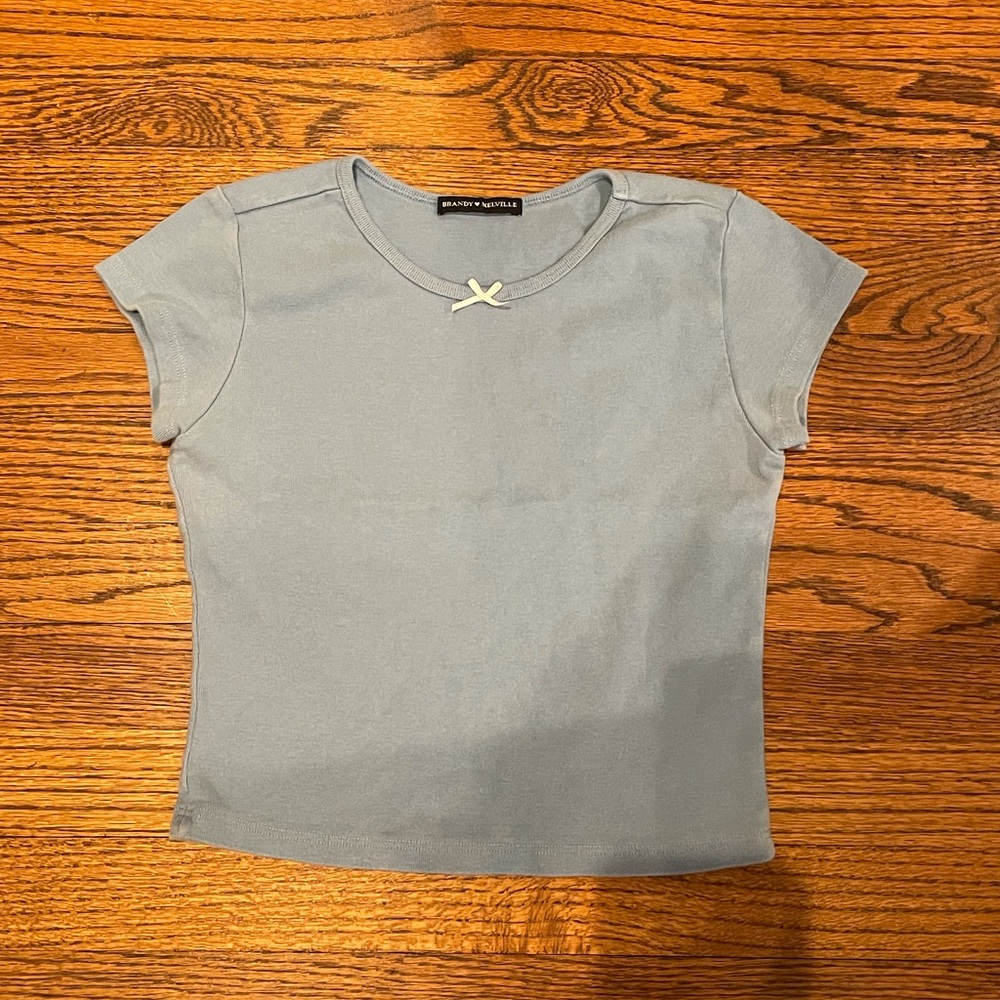 Blue t shirt with a white bow